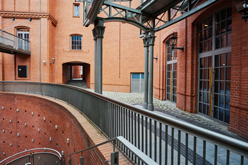 The metal structure  and brick wall in an old brewery in Poznan. © GKor