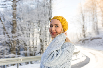 Woman in winter hat, winter. Portrait of attractive young girl i