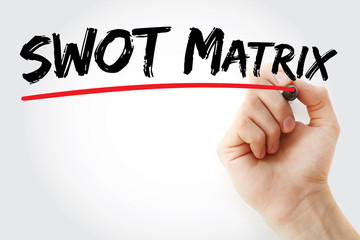 Hand writing SWOT matrix with marker, concept background