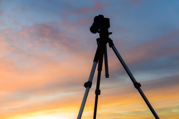 Silhouette of camera against sunset