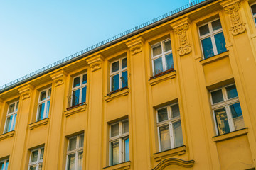 Fototapeta na wymiar luxury orange facade with beautiful detailed windows