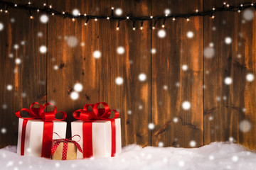 Christmas gifts snow, wooden background