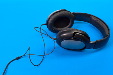 Headphones on blue background