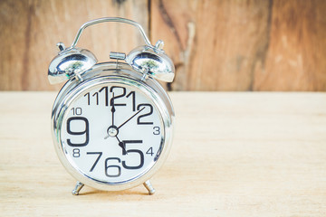 Clock on wood background