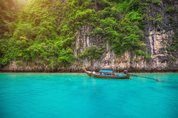 Fototapeta na wymiar Long boat and blue water at Maya bay in Phi Phi Island, Krabi Th
