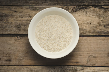 Rice in a plate. Ready for cooking. Healthy food.