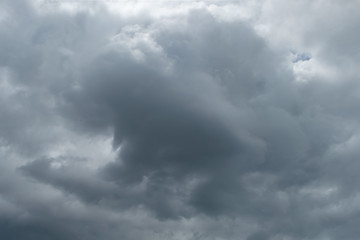 Obraz premium Dark storm clouds background. Rainy ominous grey storm clouds - dramatic sky