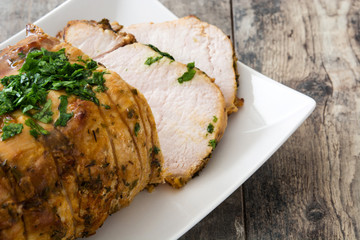 Roasted pork on wooden table
