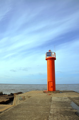 orange lighthouse on Mangalsalas mols, Riga, Baltic sea
