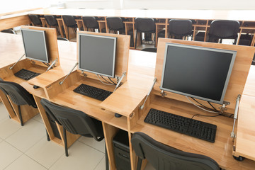 Workplace room with computers in row.