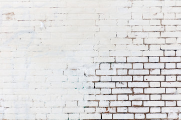 white old brick wall painted half