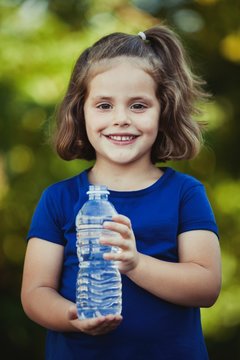 Cute little girl with water bottle