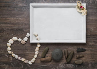 heart of stone with wooden frame on the texture on the background. Valentines Day card