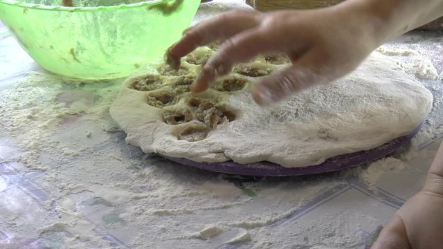 Making dumplings at home / Making dumplings at home using a special form for raviol