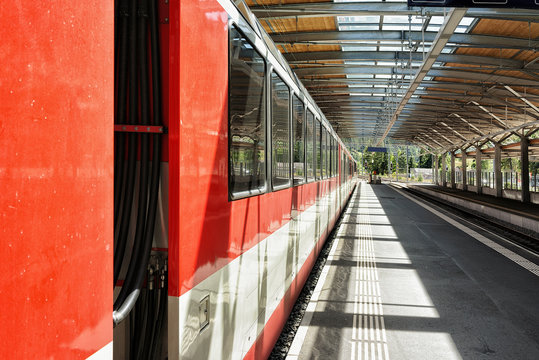 Concourse and train at Railway train station of Zermatt Switzerland