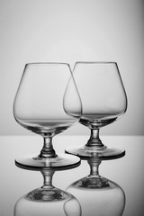 Two empty brandy glasses isolated on white background