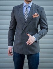 Male model posing in a grey torso jacket