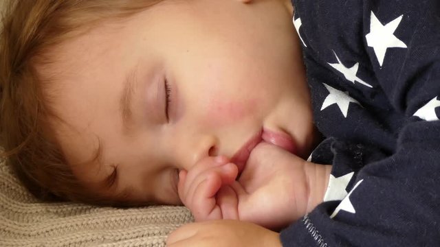 sleeping baby, sucking thumb