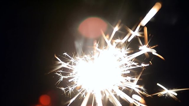 Burning sparklers. A sense of celebration. Close