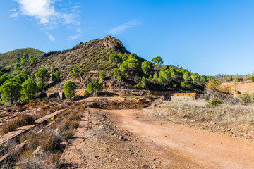 Fototapeta na wymiar Panoramic view of remains in antique exploitation of copper mine in village Sotiel Coronada in Huelva, Andalusia, Spain