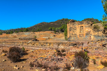 Panoramic view of remains in antique exploitation of copper mine in village Sotiel Coronada in ...