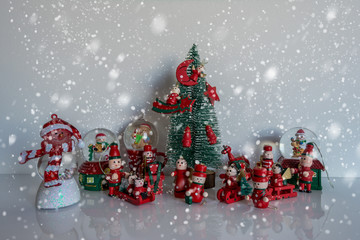 Christmas tree with wooden toys on snow