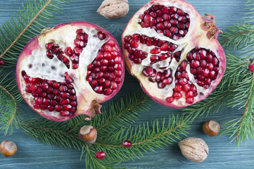 Fresh ripe garnet on wooden table. Top view. Christmas concept. Vintage style