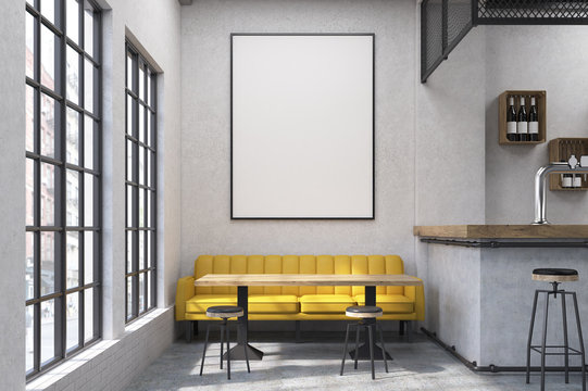 Close up of a cafe with a yellow sofa