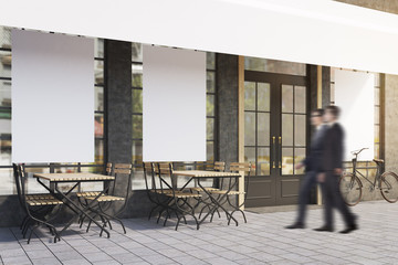 Side view of two men near a cafe