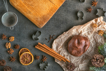Christmas - baking gingerbread concept background. Dough with ingredients, accessories and...
