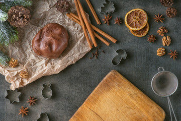 Christmas - baking gingerbread concept background. Dough with ingredients, accessories and...