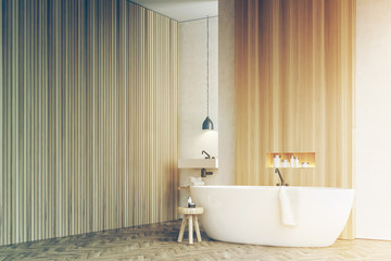Corner of a bathroom, sink chair white wood toned
