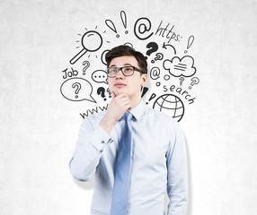 Man in glasses and web search on concrete wall