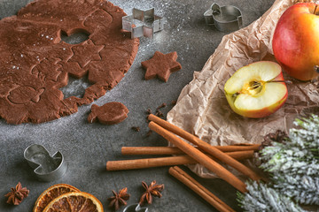 cutting gingerbread cookie with christmas decorations and spice, christmas baking