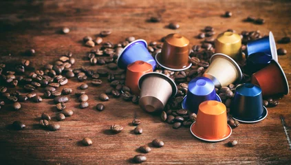  Colorful espresso capsules on wooden background © Rawf8