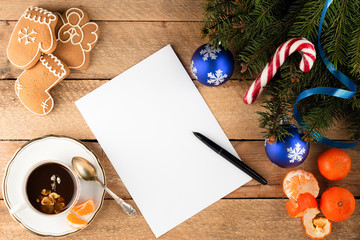 Christmas background of fir tree branches a sheet of paper on ol