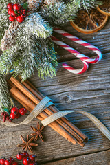 christmas background with spices and needles on wooden table, traditional christmas