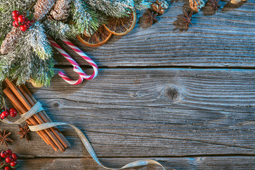 christmas background with spices and needles on wooden table, traditional christmas