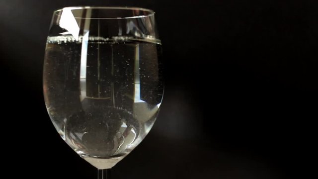 pouring water and throwing aspirine tablet