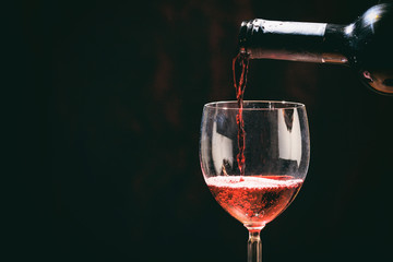 Naklejka na ściany i meble Red wine glass and bottle
