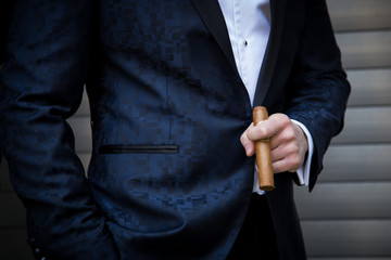 Male model with a cigar up close