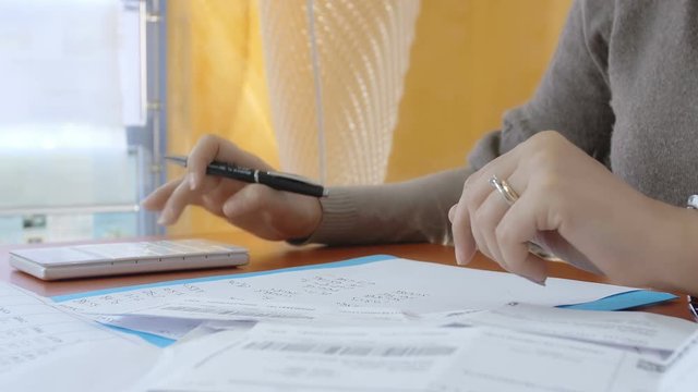 Businesswoman throws the pen on the table due some problem on budget