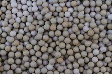 Ceramic baking beans, background and close up.