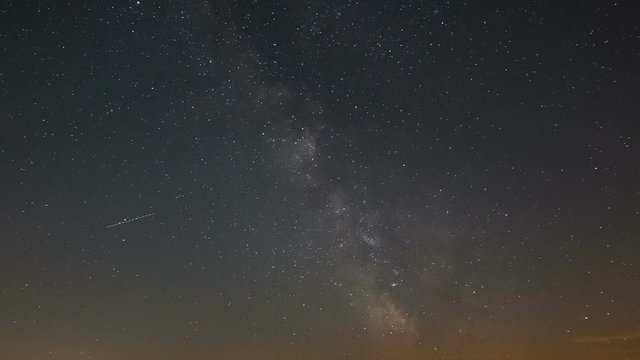 Timelapse sequence of the milky way in Germany through the short summer night with lots of air traffic
