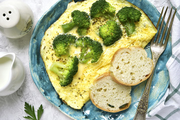Omelet stuffed with broccoli and cheese.Top view.
