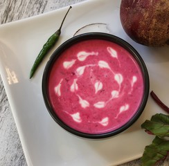 Homemade beet Soup in abowl overhead view