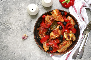 Chicken stewed in tomato sauce with bell pepper,onion and olives