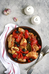 Chicken stewed in tomato sauce with bell pepper,onion and olives
