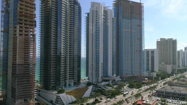 Aerial video Sunny Isles Beach FL highrise beachfront condominium