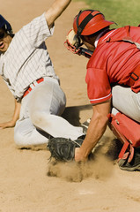 Closeup of two baseball players at home base